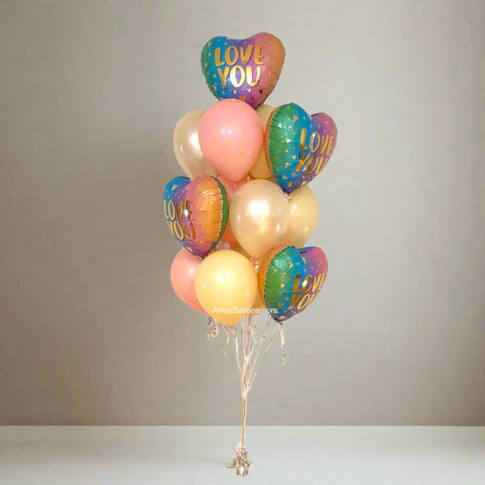 Bouquet of colorful heart-shaped balloons with 'LOVE YOU' text against a light background